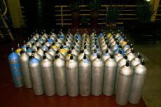 A typical collection of aluminium dive cylinders awaiting refill at a dive center