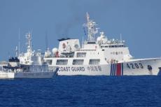A Chinese Coast Guard ship allegedly obstructs the Philippine Coast Guard vessel Malabrigo as it provided support during a Philippine Navy operation near Second Thomas Shoal in the disputed South China Sea, June 30, 2023