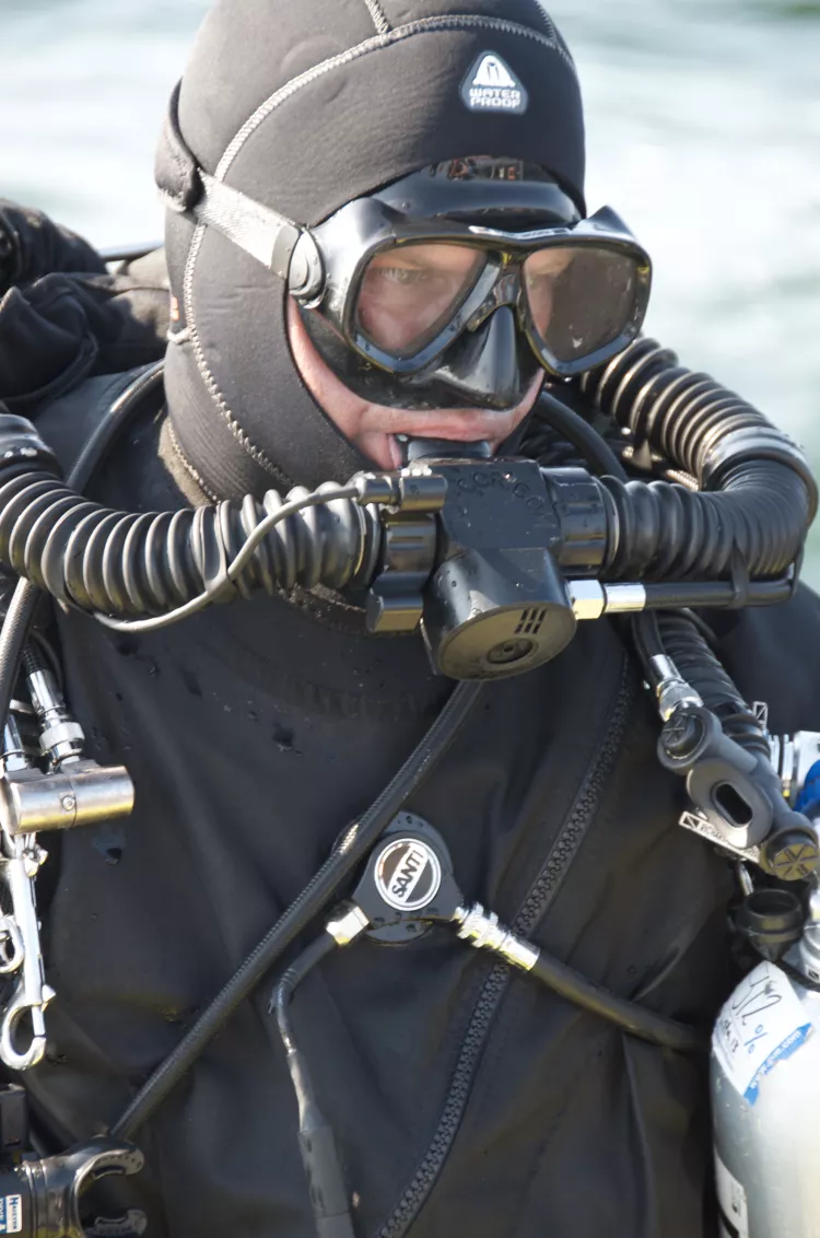 Lundgren pre-breathing his rebreather before a dive 