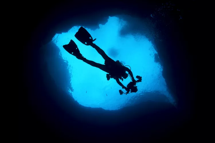 Diver (above) descends into the Blue Hole of Gozo. Photo by Michael Salvarezza and Christopher P. Weaver.